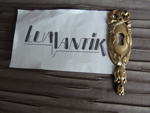 Entrée clé ancienne en bronze ruban et noeud Louis XVI