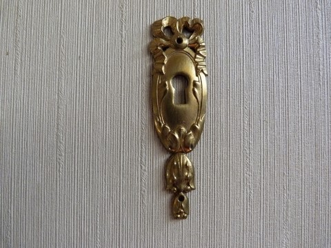 Entrée clé ancienne en bronze ruban et noeud Louis XVI