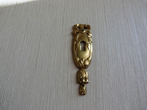 Entrée clé ancienne en bronze ruban et noeud Louis XVI